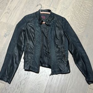 Jean jacket with faux leather details. Size Small.